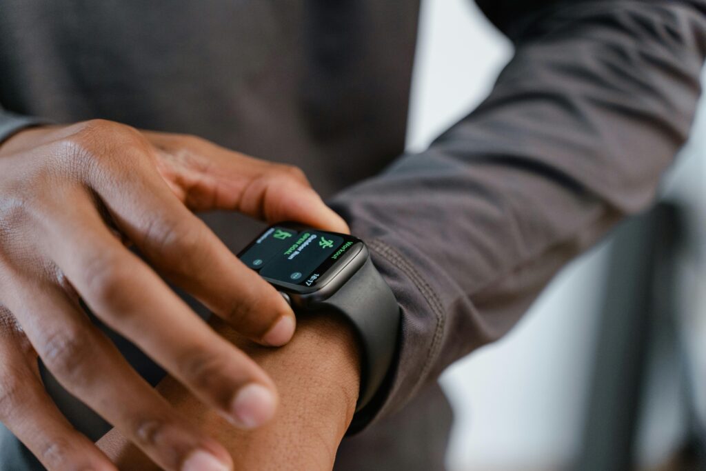 A detailed view of a smartwatch tracking fitness on a person's wrist.
